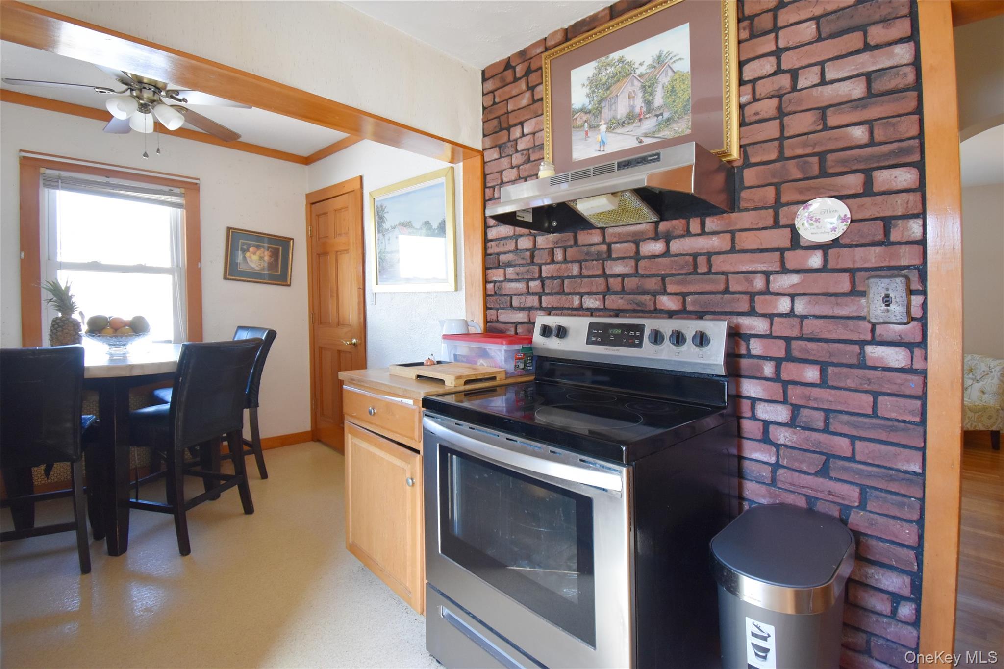 6 Sullivan Road Farmingdale, NY 11735 - Photo 8 of 21 a kitchen with a stove and chairs