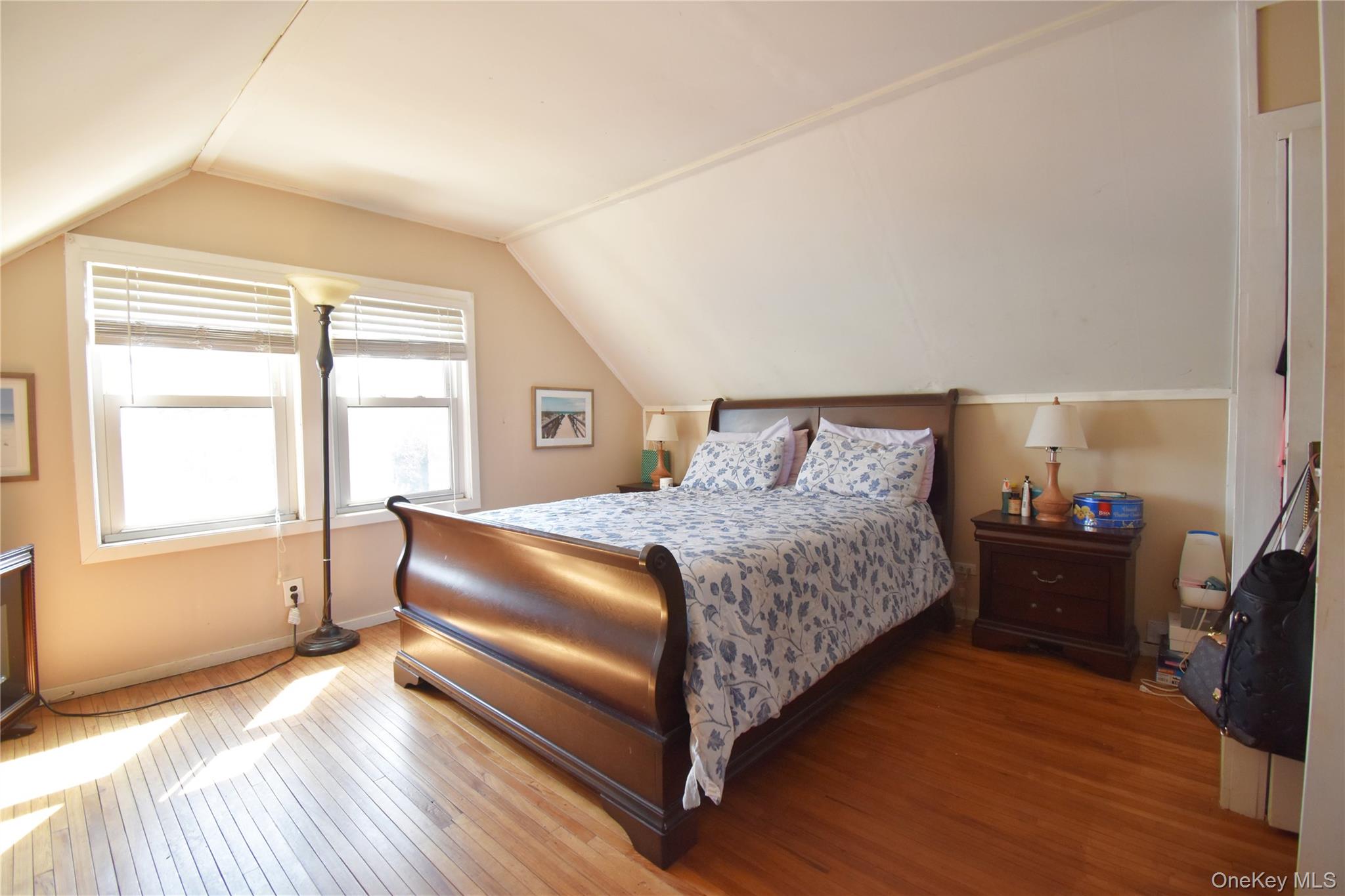 6 Sullivan Road Farmingdale, NY 11735 - Photo 9 of 21 a spacious bedroom with a bed and wooden floor