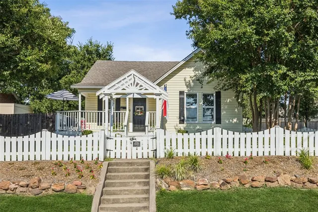 a front view of a house with a small yard