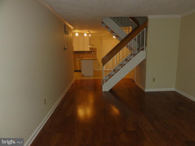 2371 Southgate Square Reston, VA 20191 - Photo 14 of 16 a view of entryway and hall with wooden floor