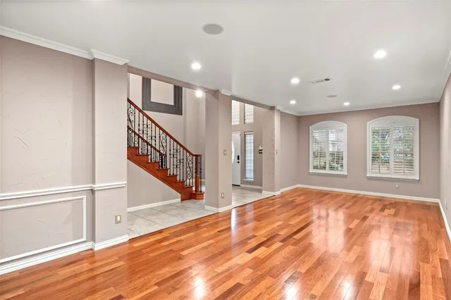 a view of an entryway with wooden floor