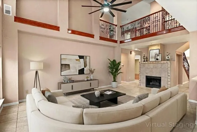 a living room with furniture and a fireplace