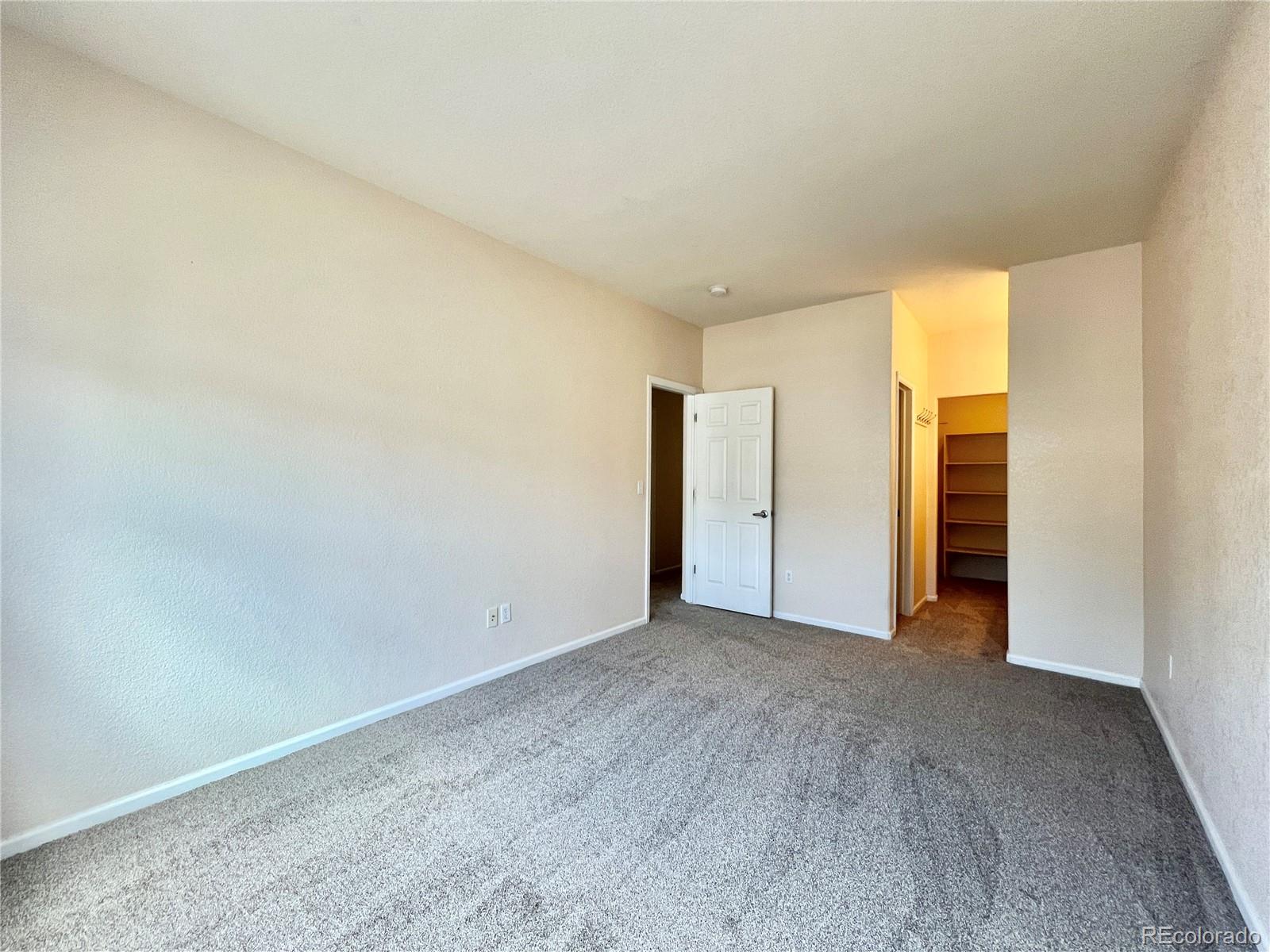 1385 South Chambers Road, Unit 102 Aurora, CO 80017 - Photo 9 of 20 a view of an empty room and window