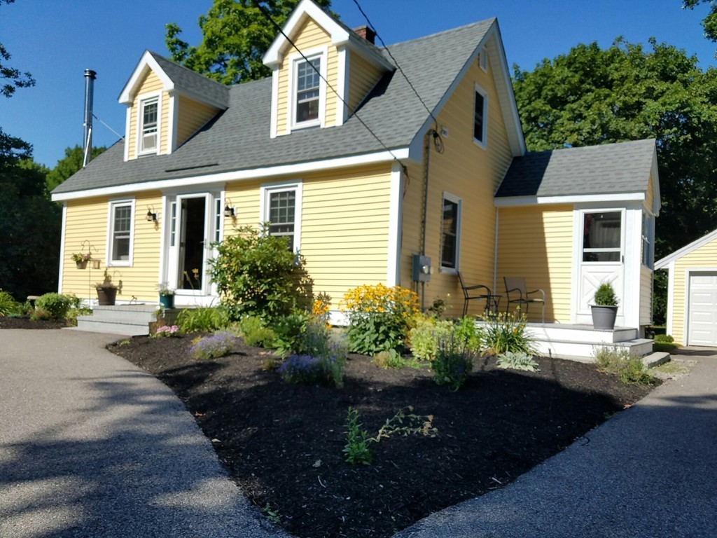 200 Pierce Street Rochester, MA 02770 - Photo 2 of 16 a front view of a house with a yard