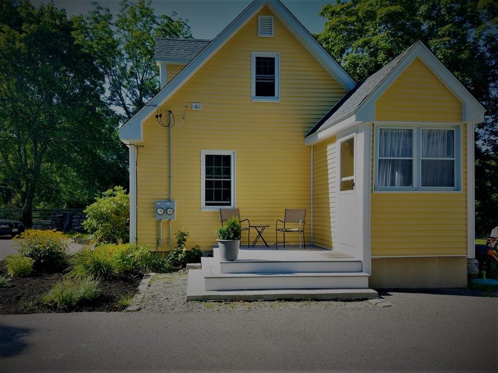 200 Pierce Street Rochester, MA 02770 - Photo 8 of 16 a front view of a house with a garden