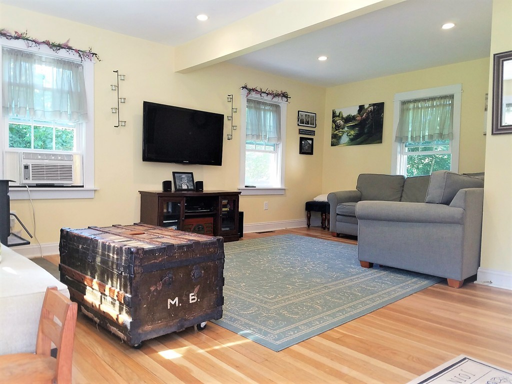 200 Pierce Street Rochester, MA 02770 - Photo 10 of 16 a living room with furniture and a flat screen tv
