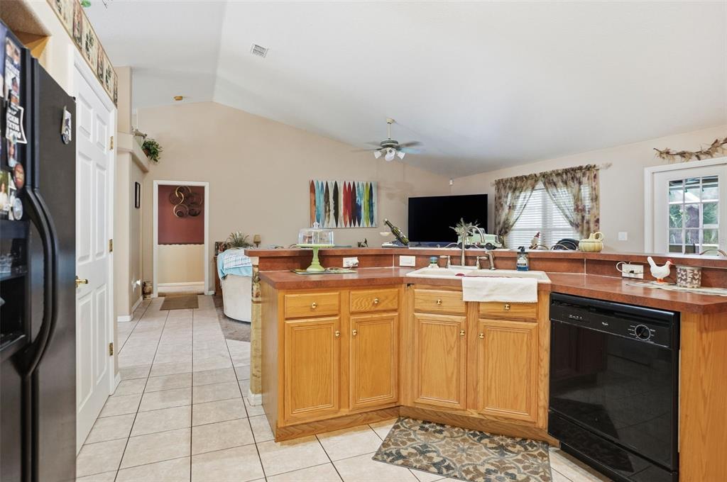 204 Planter Road Spring Hill, FL 34606 - Photo 11 of 45 a kitchen with a sink and cabinets