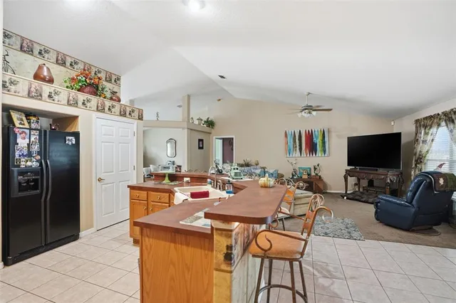 a view of a livingroom with furniture and flat screen tv