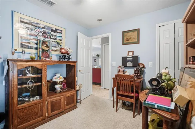 a room with furniture toys and a large window