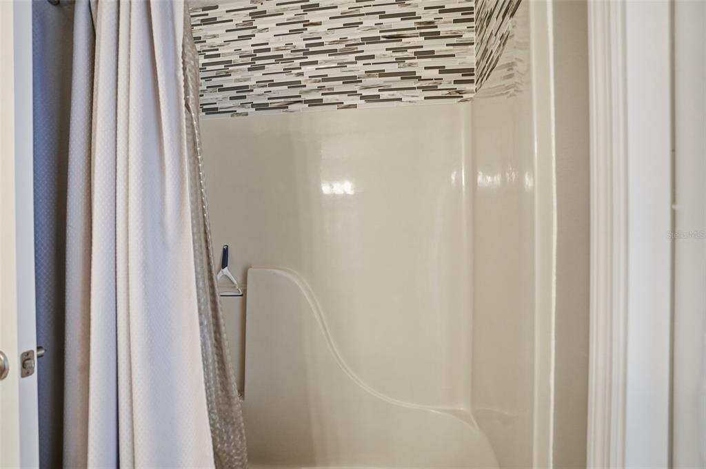 204 Planter Road Spring Hill, FL 34606 - Photo 23 of 45 a bathroom with a shower