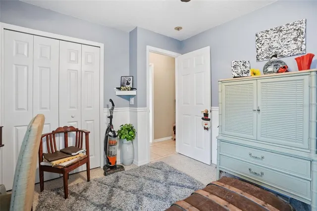 a view of a hallway with closet and toys