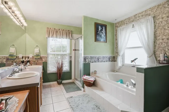 a bath room with a sink and a bath tub