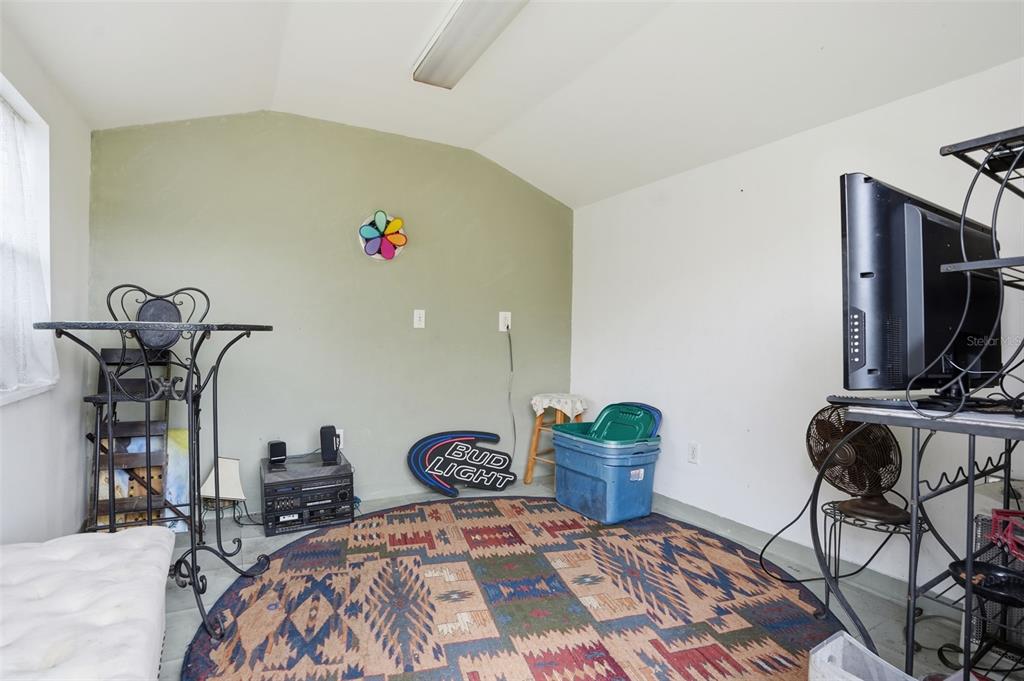 204 Planter Road Spring Hill, FL 34606 - Photo 32 of 45 a bedroom with furniture and a window