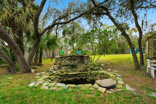 a backyard of a house with lots of green space