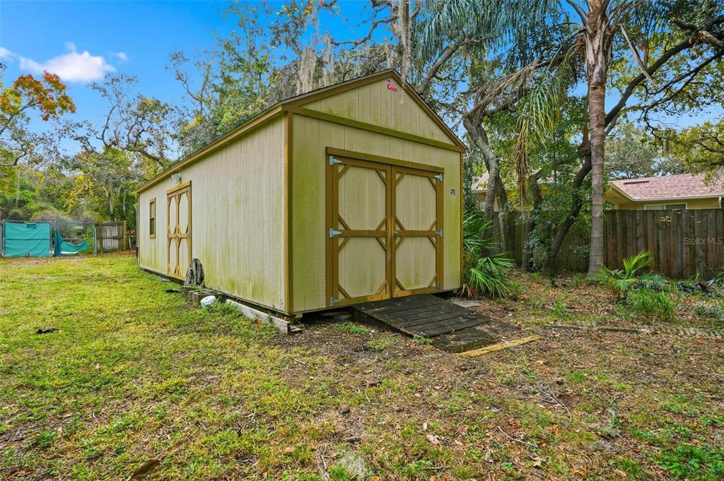 204 Planter Road Spring Hill, FL 34606 - Photo 41 of 45 a view of backyard of house with green space