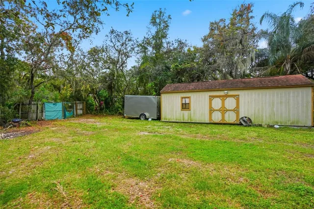 a backyard of a house with lots of green space