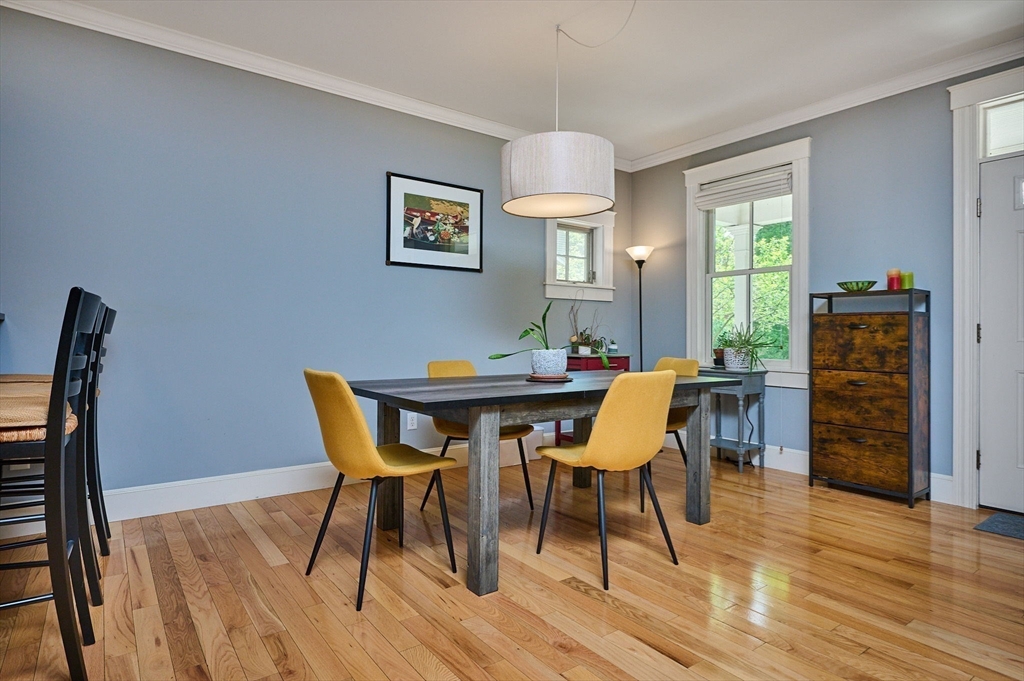 25 Union Street, Unit 2 Northampton, MA 01060 - Photo 13 of 38 a dining room with furniture a chandelier and wooden floor