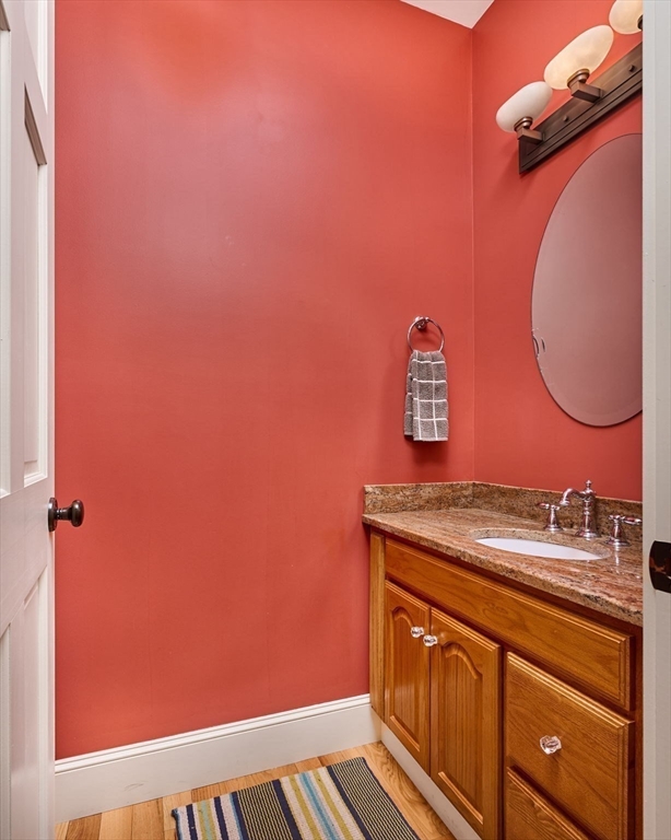 25 Union Street, Unit 2 Northampton, MA 01060 - Photo 18 of 38 a bathroom with a sink a vanity and mirror