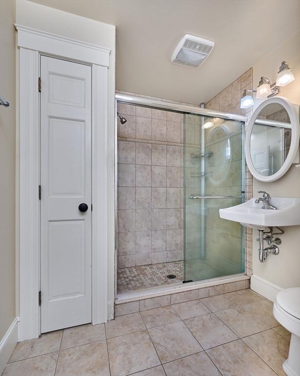 25 Union Street, Unit 2 Northampton, MA 01060 - Photo 26 of 38 a bathroom with a sink a toilet and shower