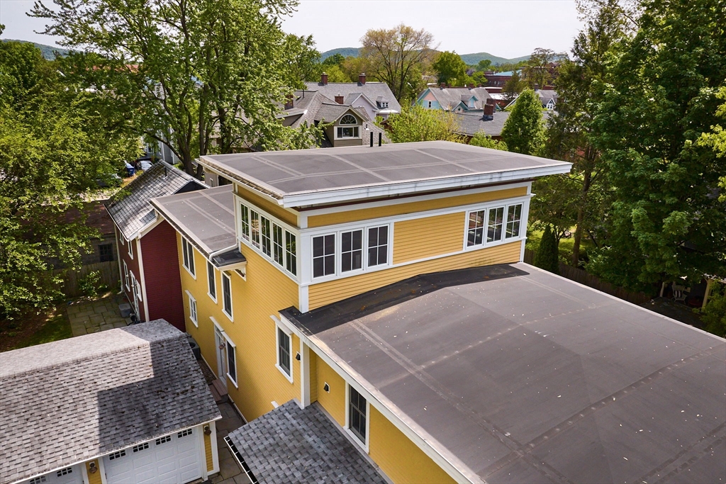 25 Union Street, Unit 2 Northampton, MA 01060 - Photo 36 of 38 a aerial view of a house with balcony and trees al around