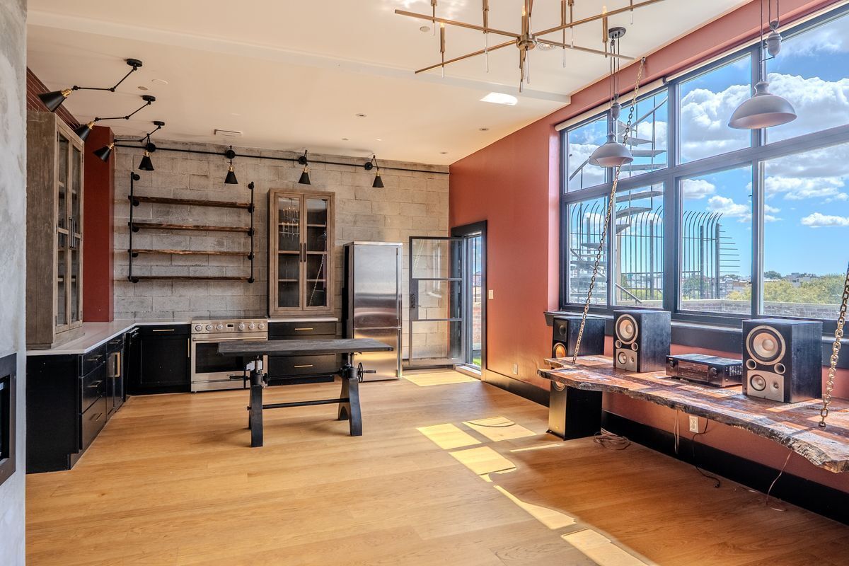231 Norman Avenue, Unit 511 Brooklyn, NY 11222 - Photo 12 of 30 a living room with furniture a rug and a large window