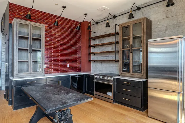 a kitchen that has a sink and a stove