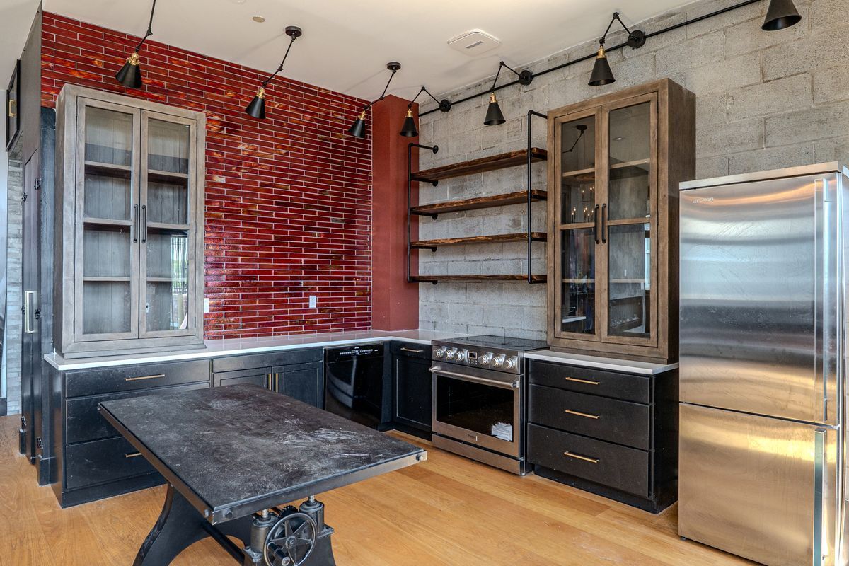 231 Norman Avenue, Unit 511 Brooklyn, NY 11222 - Photo 15 of 30 a kitchen with stainless steel appliances granite countertop a stove and a refrigerator