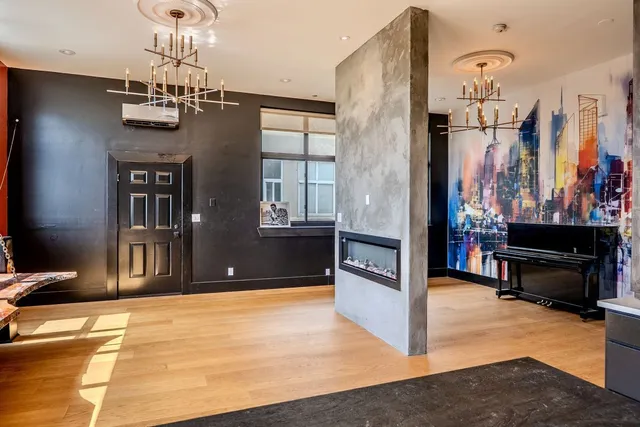 a kitchen with stainless steel appliances kitchen island granite countertop a stove a sink and a microwave