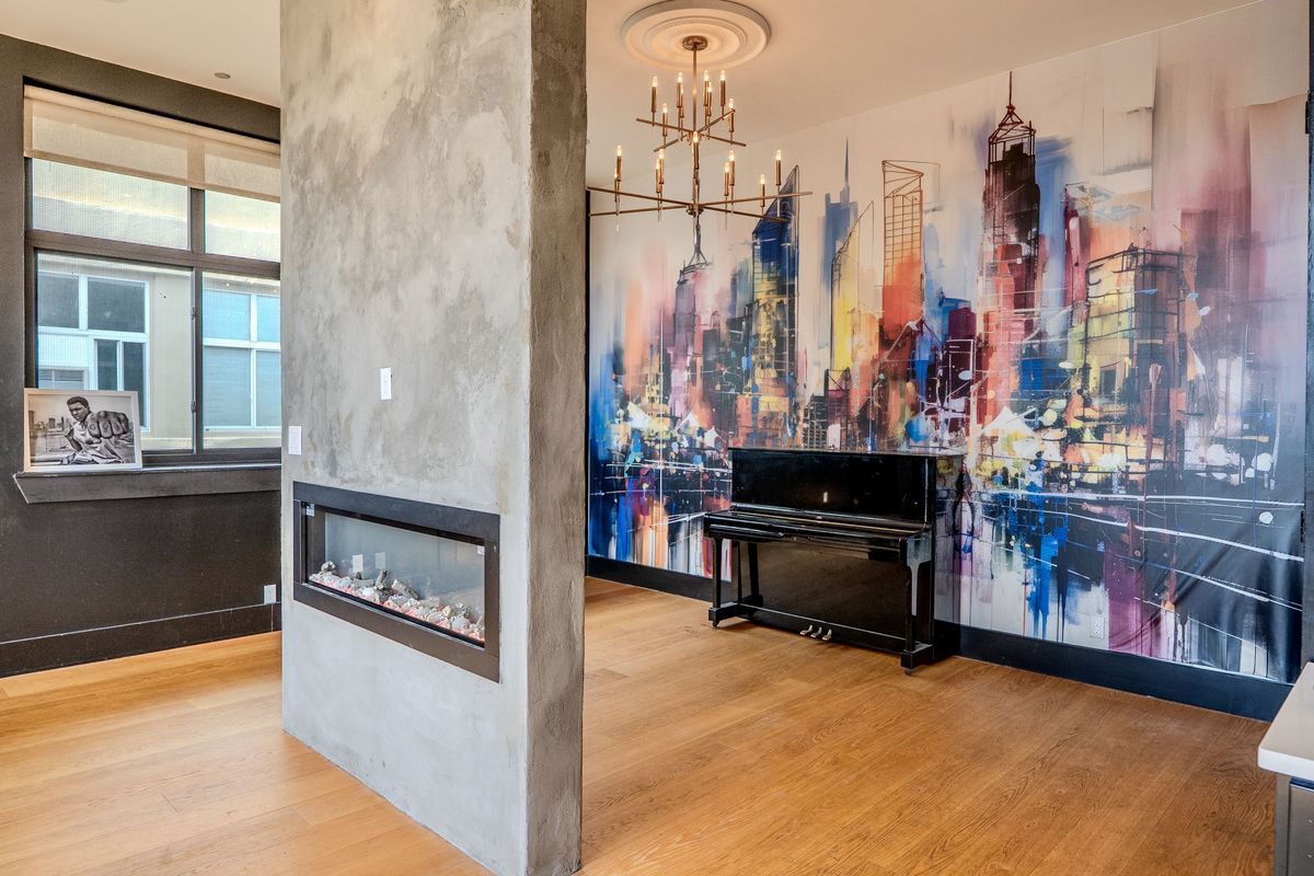 231 Norman Avenue, Unit 511 Brooklyn, NY 11222 - Photo 19 of 30 a kitchen with stainless steel appliances kitchen island granite countertop a stove a sink and a microwave