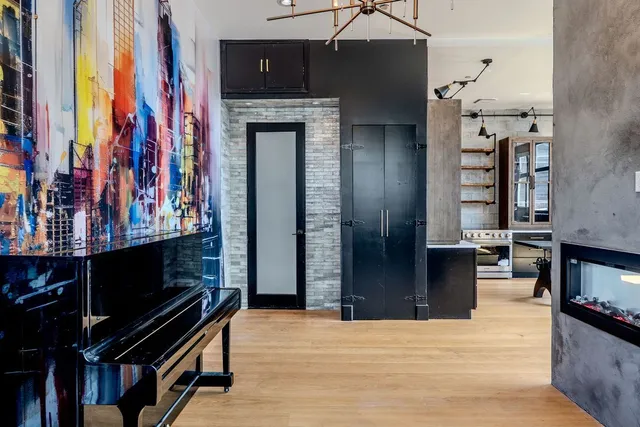 a living room with furniture wooden floor and a fireplace