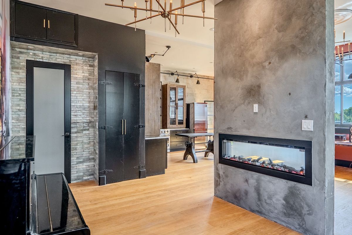 231 Norman Avenue, Unit 511 Brooklyn, NY 11222 - Photo 24 of 30 a living room with stainless steel appliances kitchen island granite countertop furniture a rug and a kitchen view