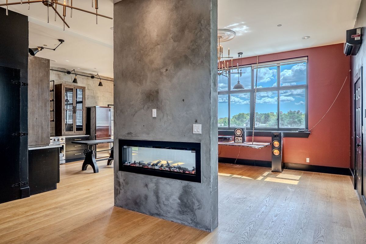 231 Norman Avenue, Unit 511 Brooklyn, NY 11222 - Photo 25 of 30 a living room with furniture wooden floor and a fireplace