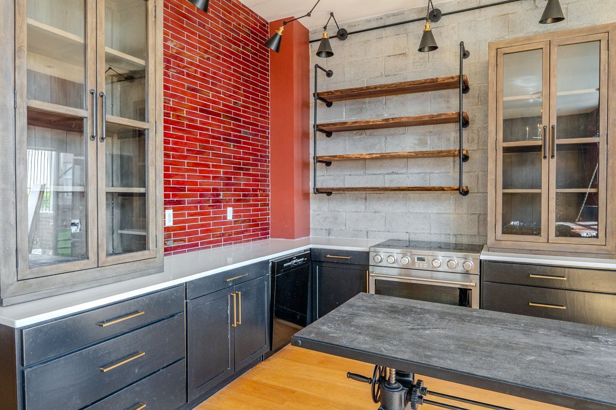 231 Norman Avenue, Unit 511 Brooklyn, NY 11222 - Photo 27 of 30 a kitchen with stainless steel appliances granite countertop a stove and a sink