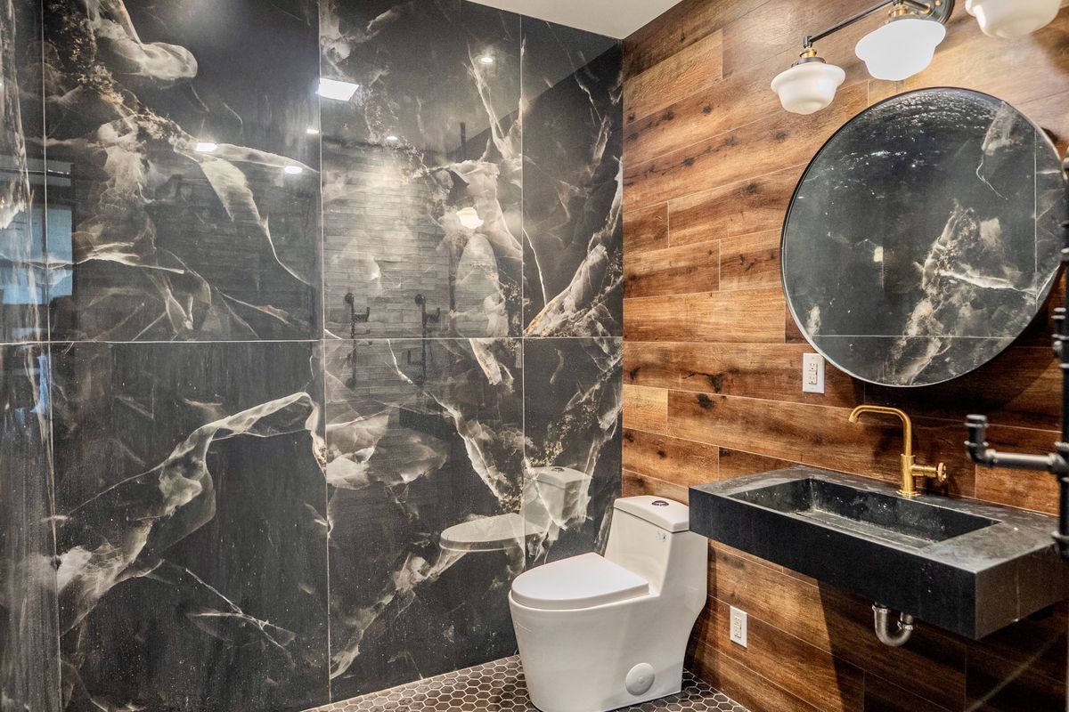231 Norman Avenue, Unit 511 Brooklyn, NY 11222 - Photo 28 of 30 a bathroom with a sink and a mirror