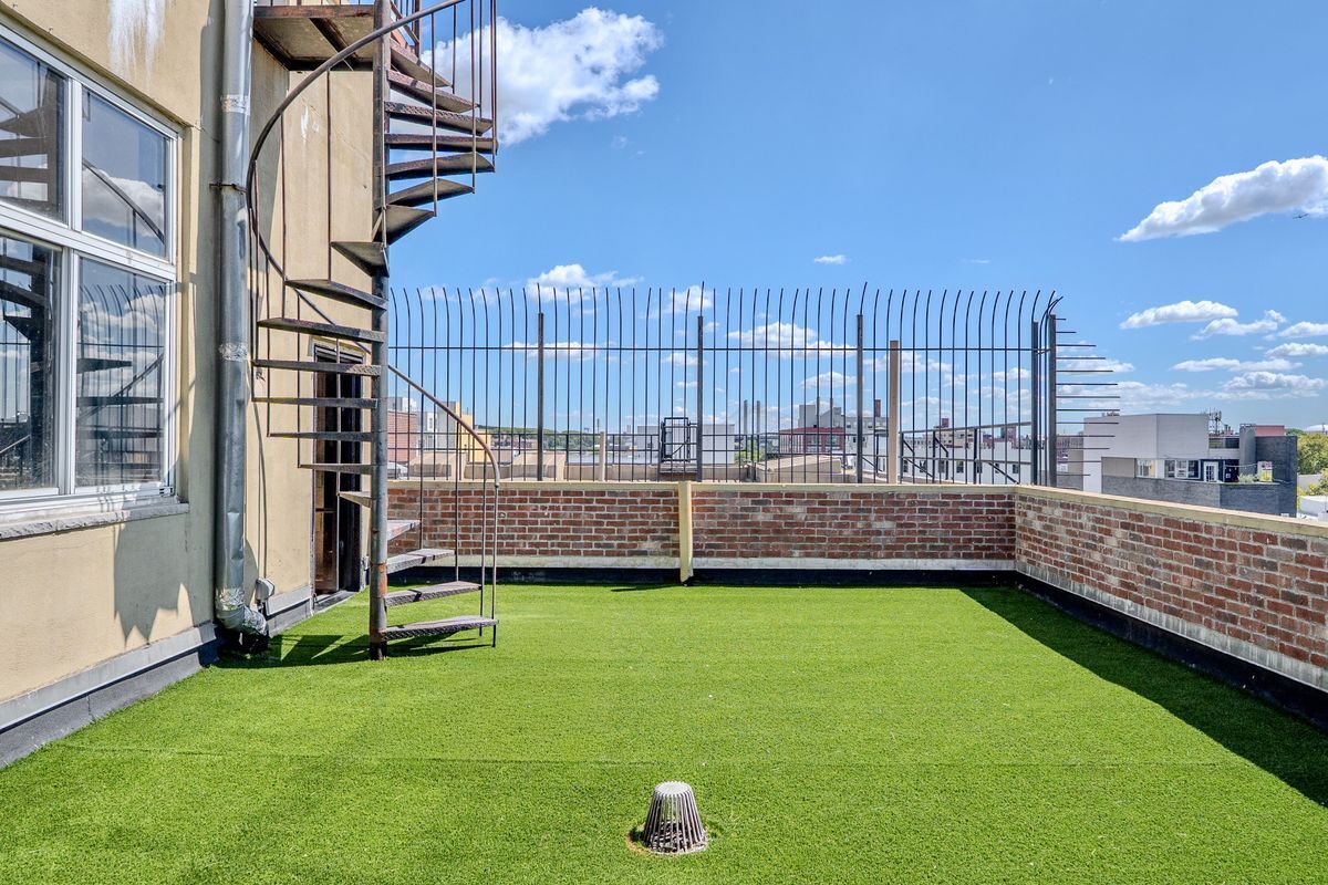 231 Norman Avenue, Unit 511 Brooklyn, NY 11222 - Photo 5 of 30 a view of a swimming pool with a garden