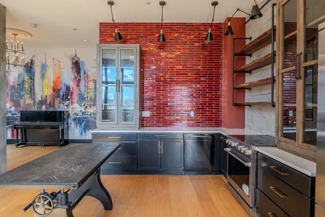 a kitchen that has a sink and a stove