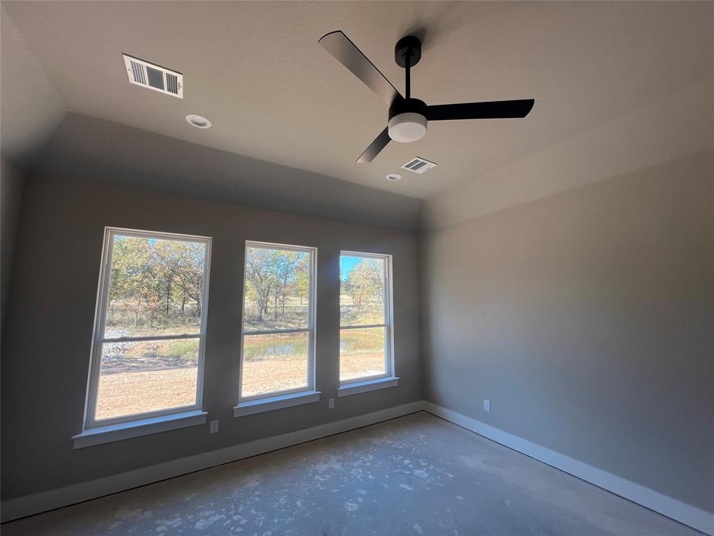 1053 Llano Way Poolville, TX 76487 - Photo 16 of 26 an empty room with windows