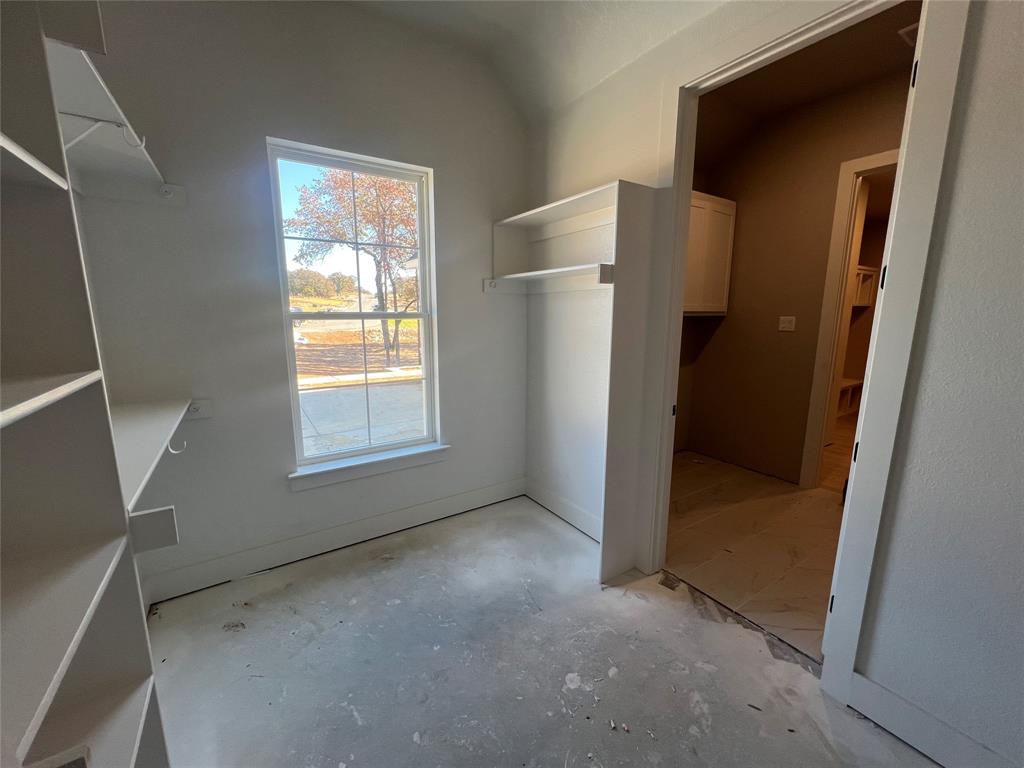 1053 Llano Way Poolville, TX 76487 - Photo 20 of 26 a view of empty room with windows