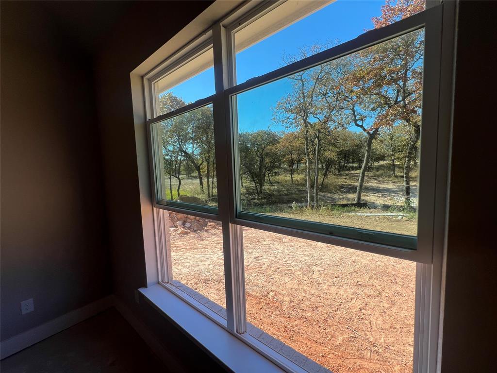 1053 Llano Way Poolville, TX 76487 - Photo 23 of 26 a view of a room with window