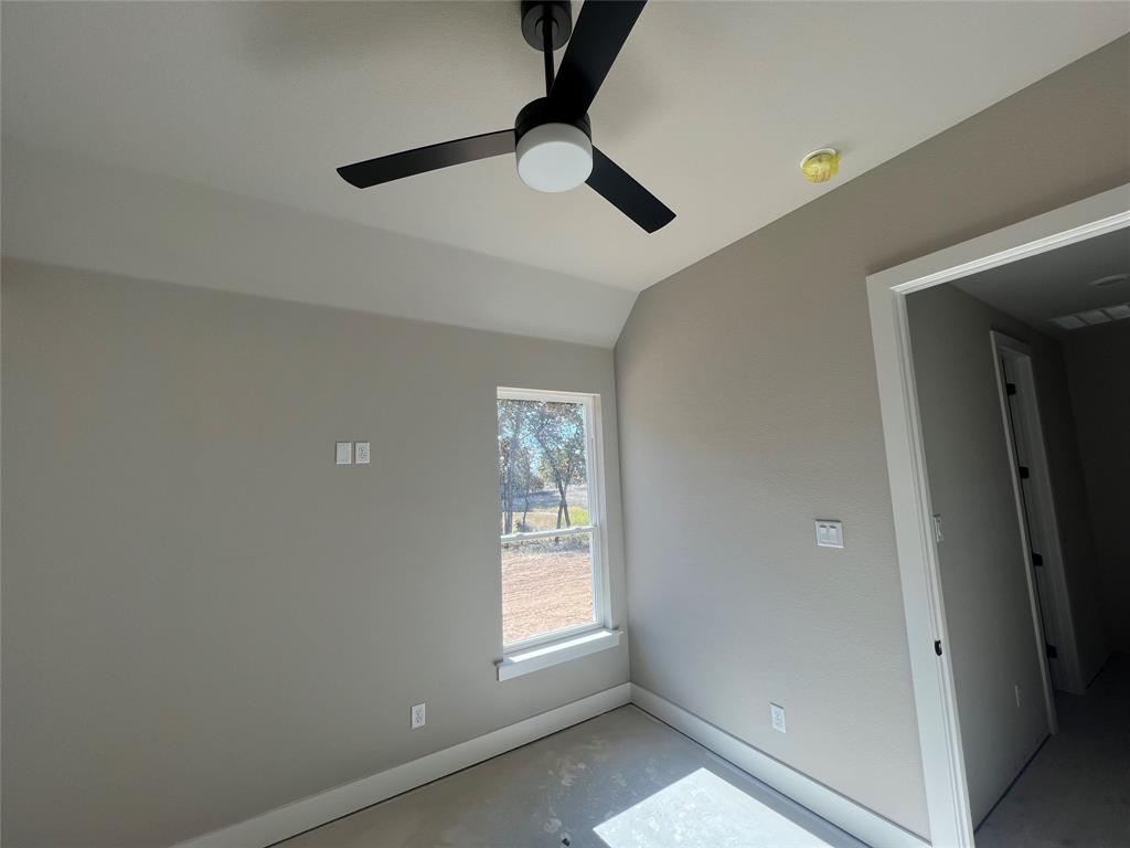 1053 Llano Way Poolville, TX 76487 - Photo 25 of 26 a view of room with window and ceiling fan