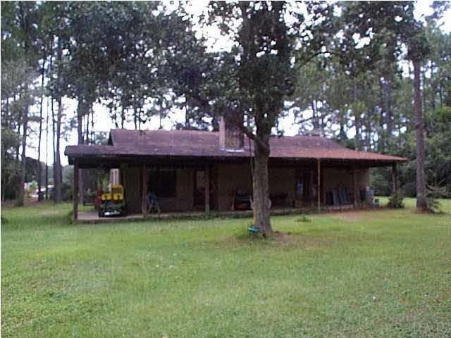 Rear view from rear property line. Large Covered Porch.