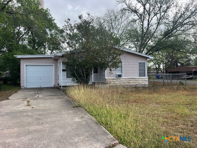 209 Highland Street Yoakum, TX 77995 - Photo 1 of 10 a view of a house with a yard