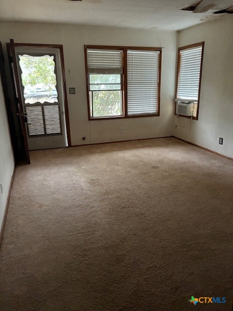 209 Highland Street Yoakum, TX 77995 - Photo 2 of 10 an empty room with windows