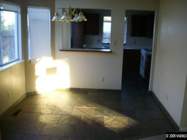 6553 Fall River Circle Reno, NV 89523 - Photo 3 of 9 a view of a bathroom with a sink and a mirror