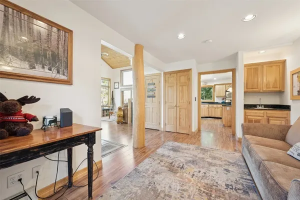 a living room with furniture and large windows