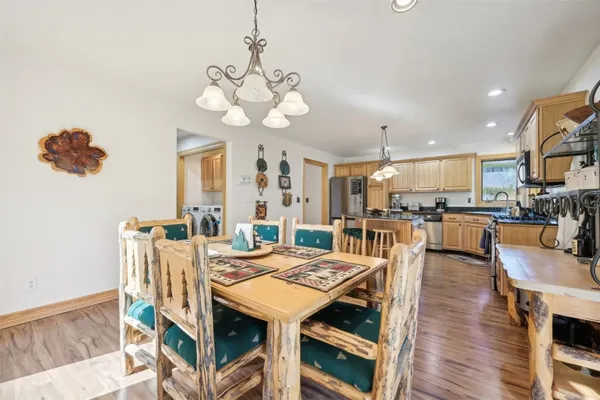 a view of a dining room with furniture and wooden floor