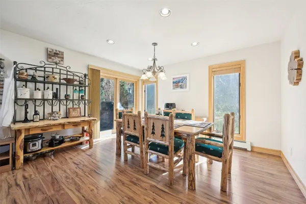 a view of a dining room with furniture window and wooden floor