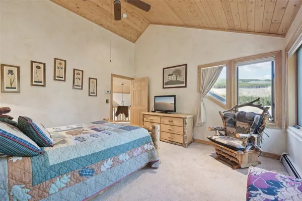 a bedroom with a bed and furniture