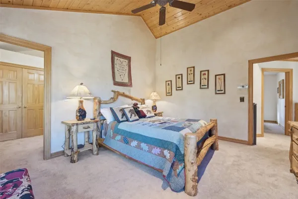 a bed room with a bed and a chair