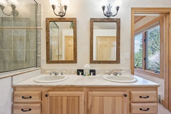 a bathroom with a sink a vanity and a mirror
